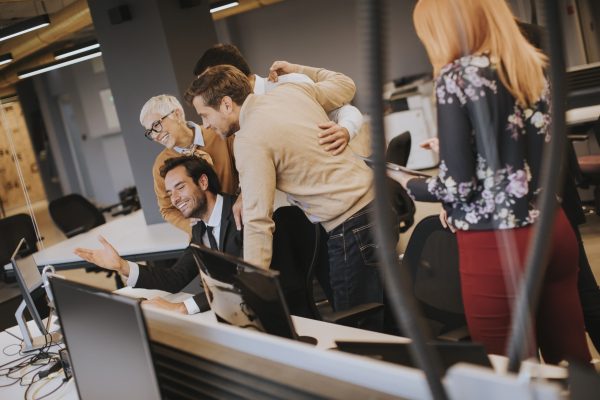 Senior businesswoman working together with young business people in the office